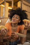 Two young women eating street food