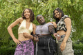 Portrait of three friends standing in park