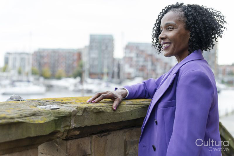 Thoughtful woman looking at city view