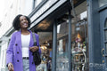 Smiling woman looking at store window