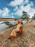 Fashion shot of young woman by river