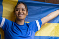 Woman holding national flag