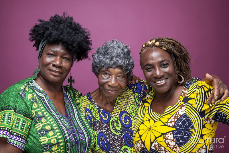 Studio portrait of senior woman with mature daughters
