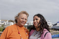 Portrait of smiling mother with daughter in harbor