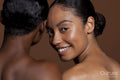 Portrait of young women against brown background