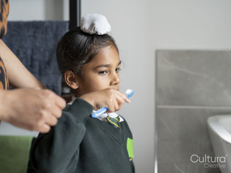 Mother and son brushing teeth