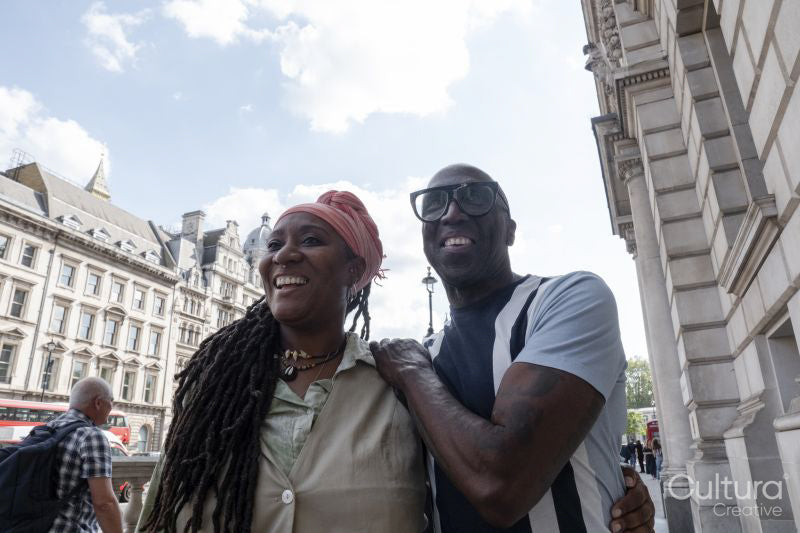 Happy mature couple visiting city