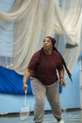 Senior woman playing badminton
