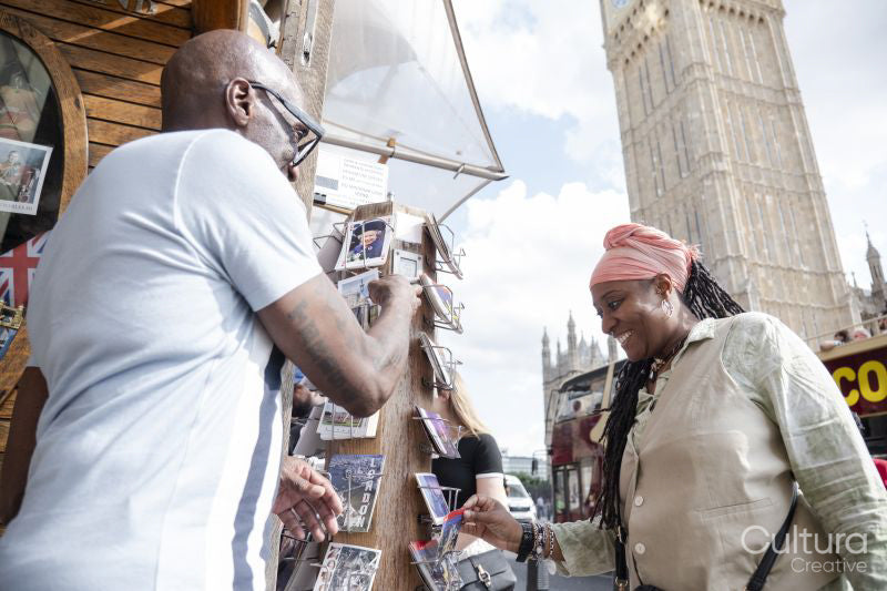 Mature couple buying souvenirs on street