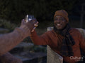 Men sitting on patio and raising toast