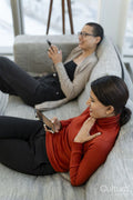 Two office workers taking break in office lobby