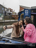 Friends taking selfie on boat