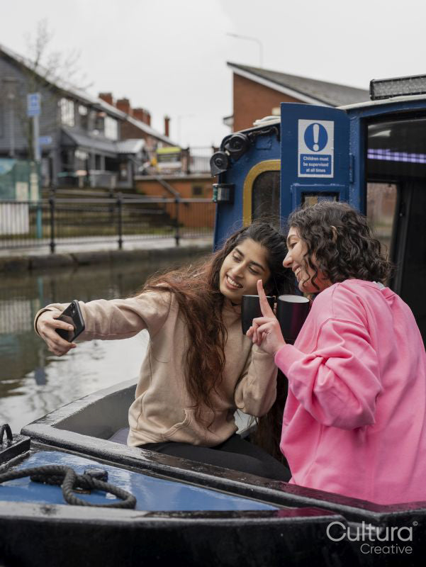 Friends taking selfie on boat