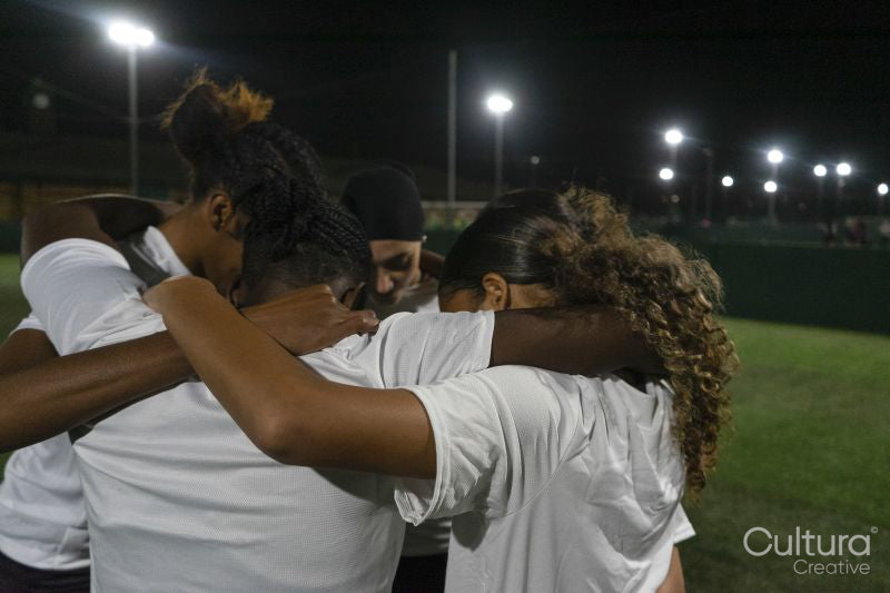 Female soccer players teaming up