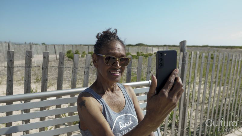 Senior woman having video call via smart phone