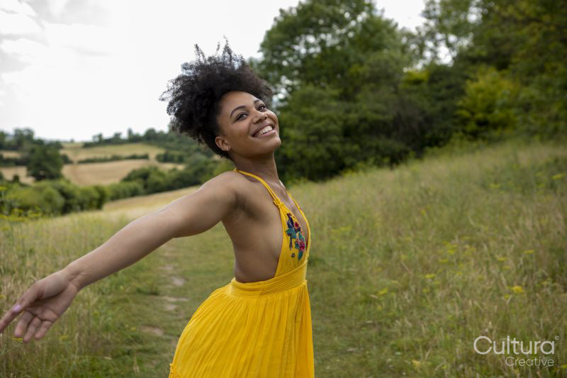 Young woman relaxing in meadow