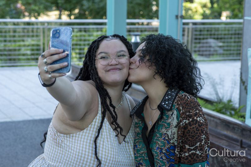 Smiling couple taking selfie outdoors