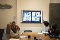Business people having video call in board room