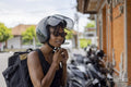Woman wearing motorcycle helmet