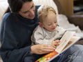 Mother and son reading at home