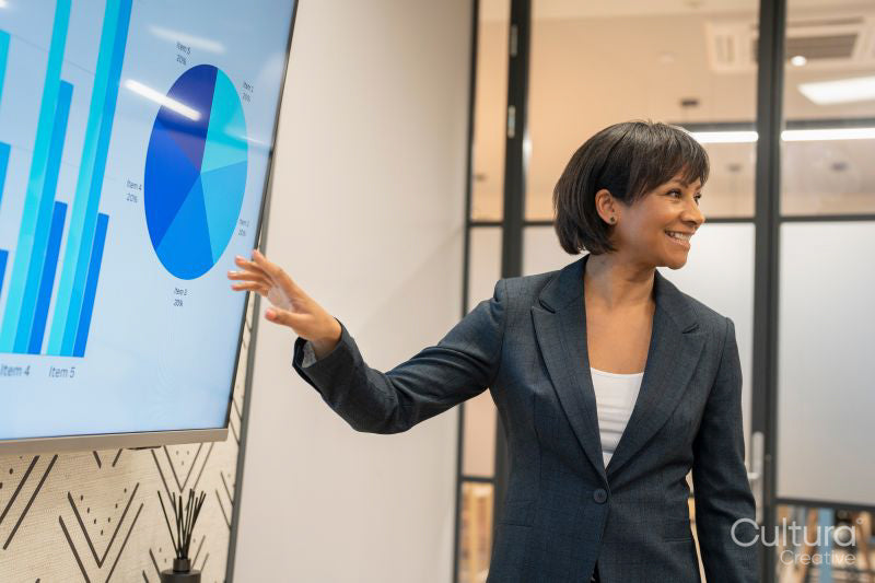 Businesswoman giving presentation in office