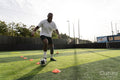 Soccer player practicing on soccer field