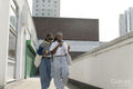 Young female couple walking in city and eating ice cream