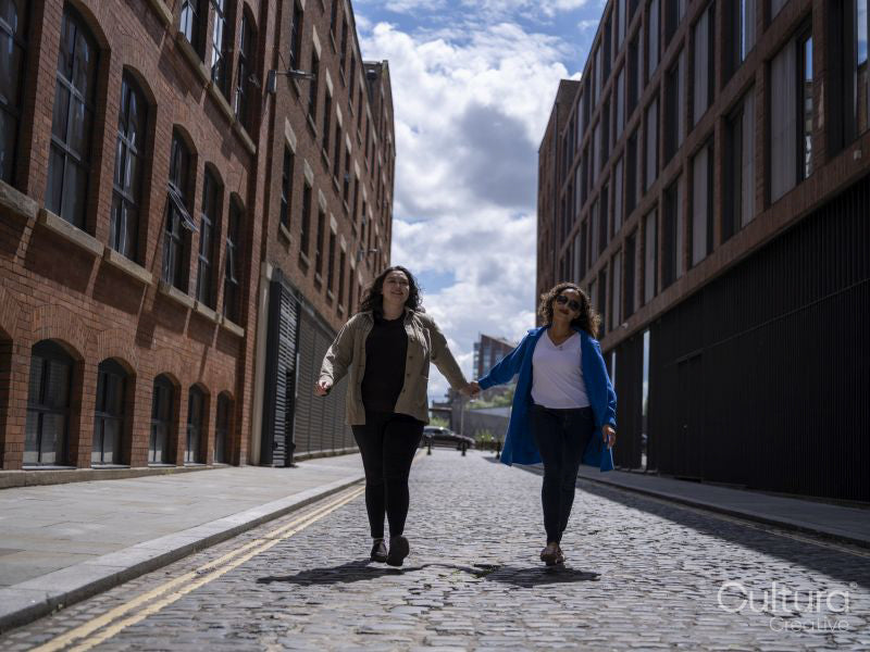 Happy couple walking on street