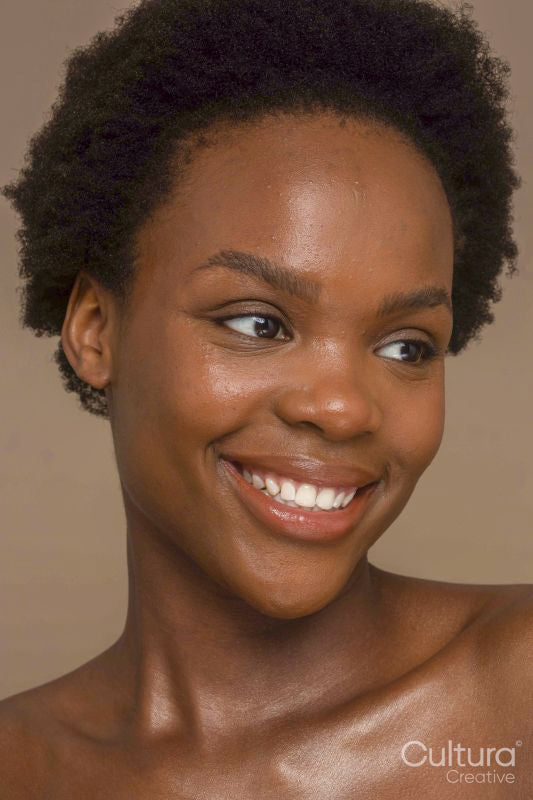 Studio portrait of smiling woman