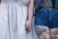 Close-up of couple holding hands