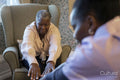 Senior woman exercising with nurse in nursing home