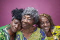 Studio shot of senior woman with mature daughters