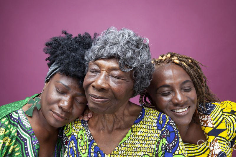 Studio shot of senior woman with mature daughters