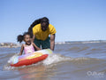 Father with daughter playing in sea