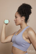 Studio shot of woman exercising with dumbbells
