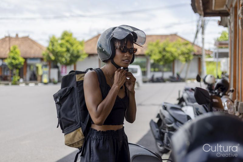 Woman wearing motorcycle helmet