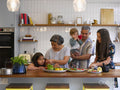 Family preparing food in kitchen