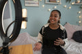 Girl filming video at home