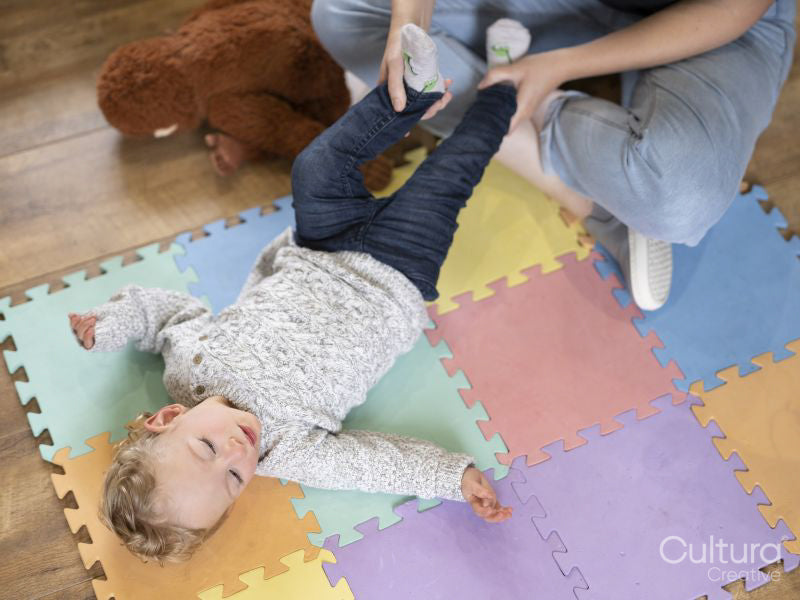 High angle of mother assisting son with exercises