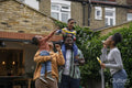 Family with children playing with soap bubbles