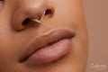 Close up portrait of non binary persons lips and pierced nose