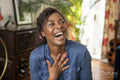 Woman laughing at home