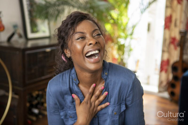 Woman laughing at home