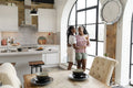 couple embracing while standing in kitchen