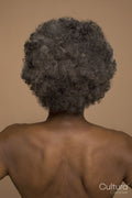 Rear view of shirtless senior woman