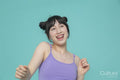 Studio portrait of smiling girl gesturing