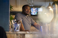 Pensive bartender at bar