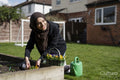 Woman wearing hijab working in garden