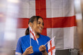 Woman holding national flags during world cup competition