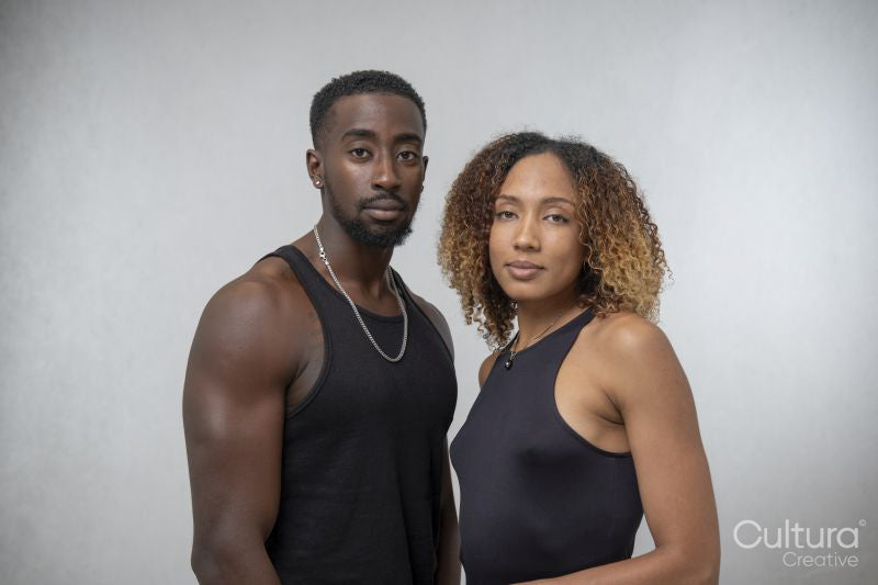 Portrait of couple wearing black tank tops